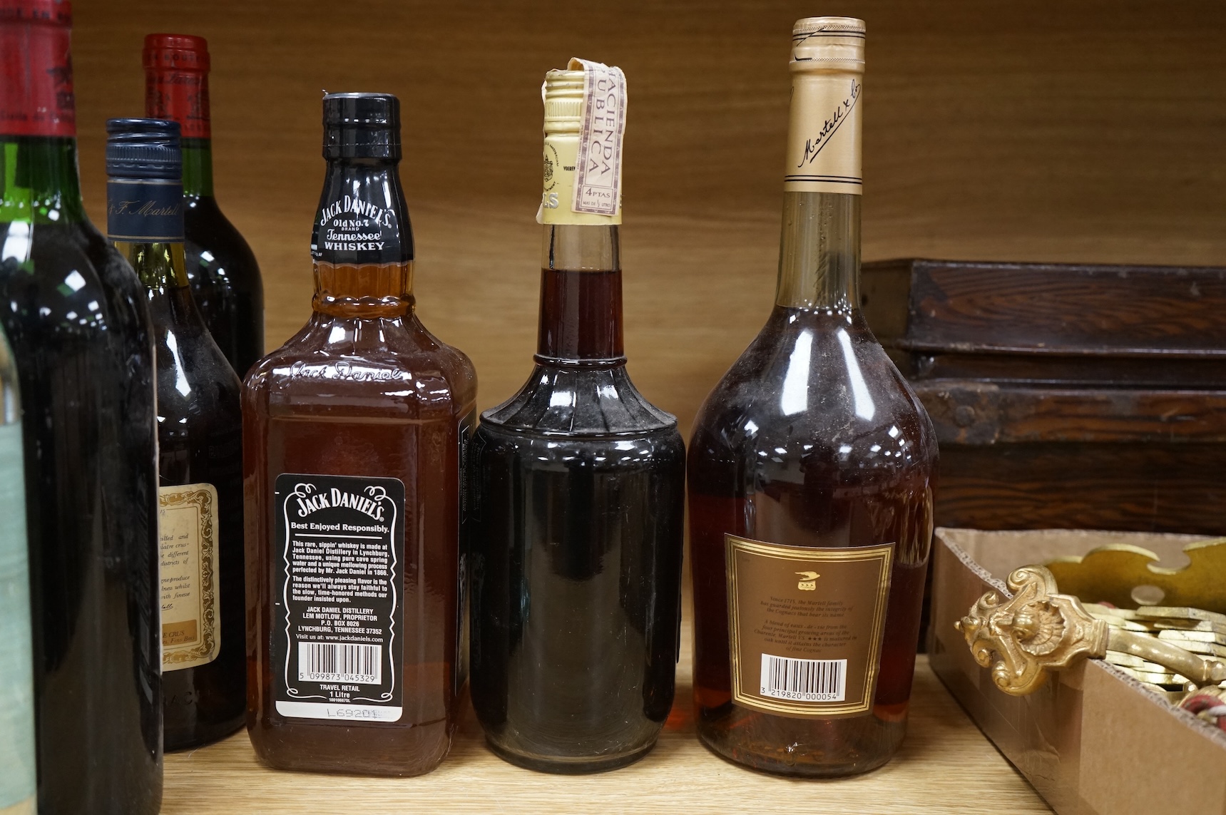 Two bottles of claret and five bottles of spirits to include Dry Cane Rum and Martel Cognac